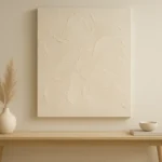 Minimalist interior featuring DIY textured abstract canvas art in neutral Scandinavian tones, radiating calm and serenity.